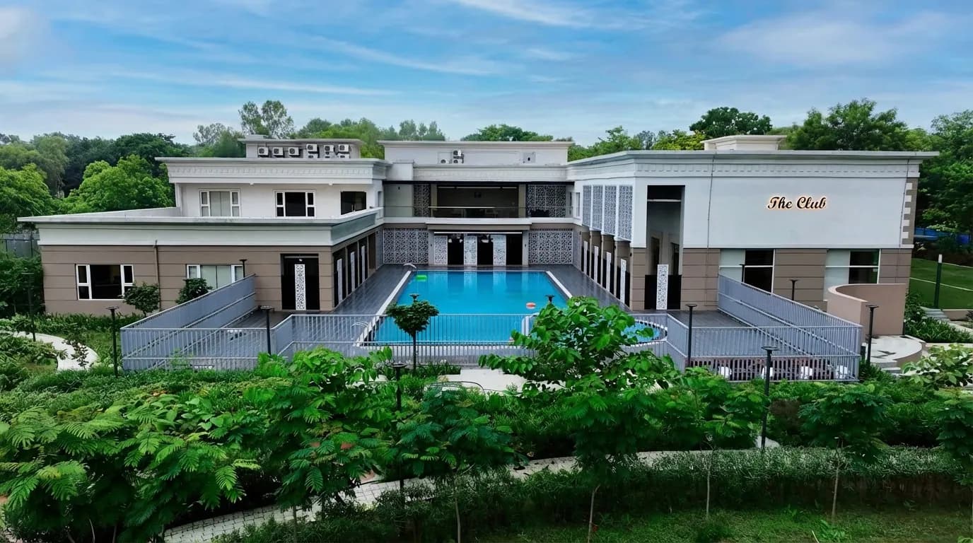 Club Anandam clubhouse exterior with pool